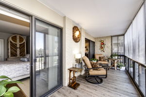 Enclosed balcony area with patio doors off of the living room and 2nd bedroom