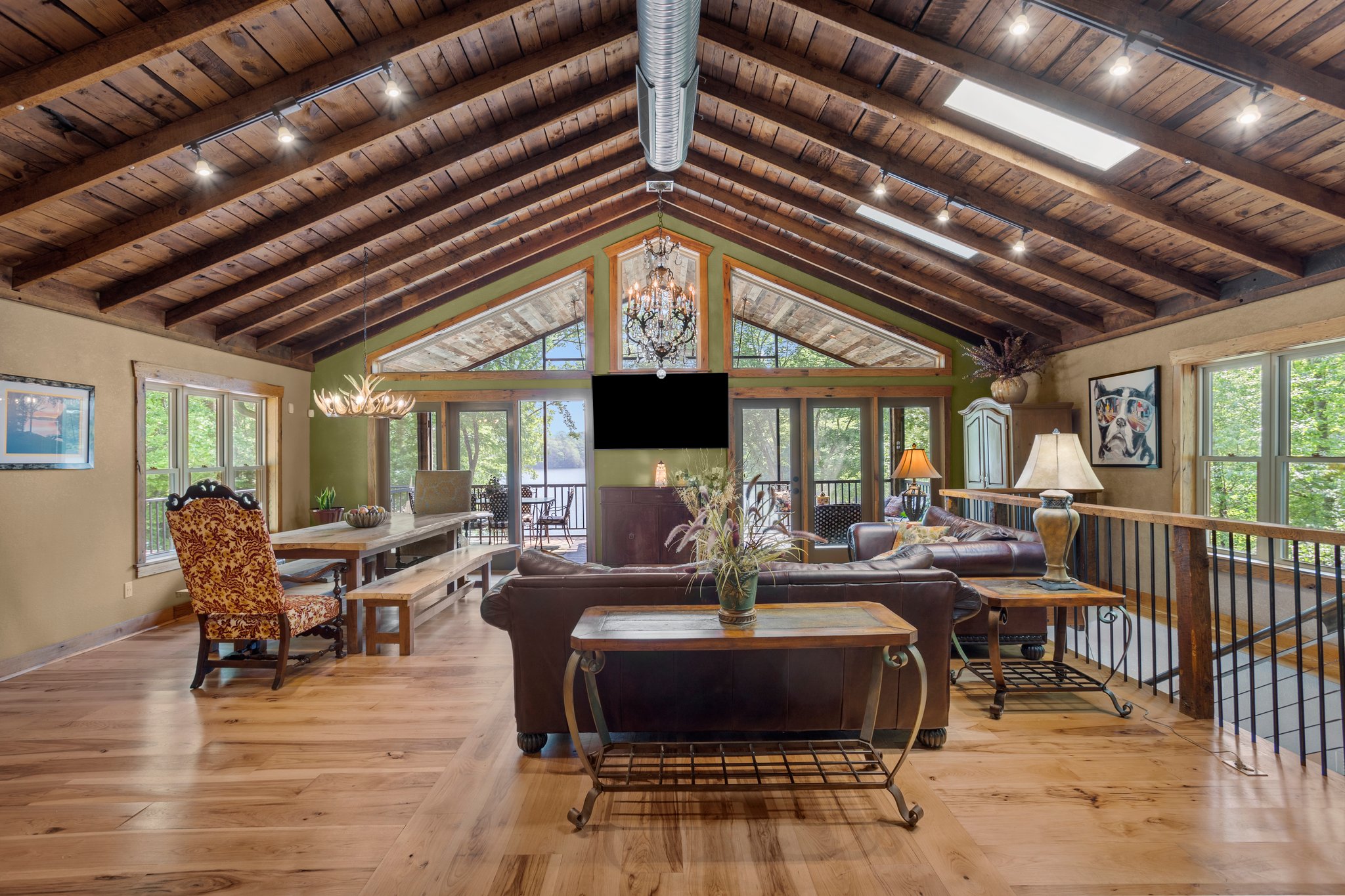 Great Room leads out to massive screen porch.