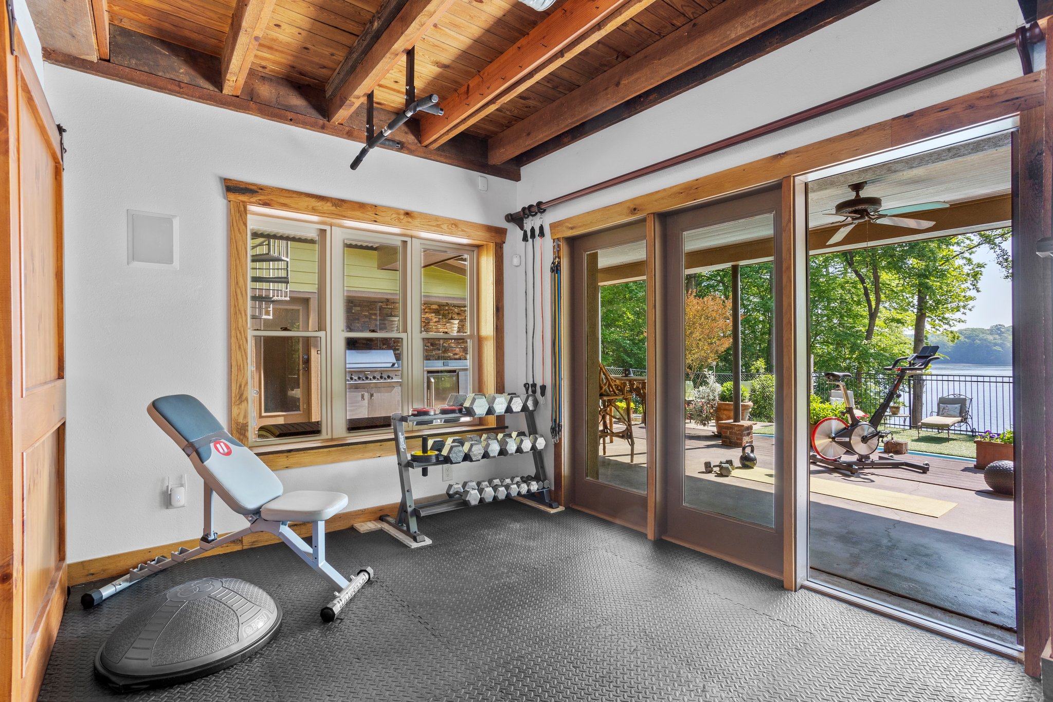 Flex space currently used as gym.  Wheel your bike out to the patio -- just like the HGTV fitness videos!