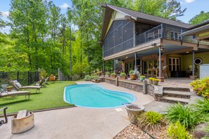 8500 gallon salt water pool with Astroturf type sun deck!