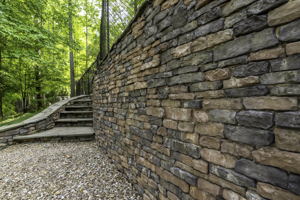 Magnificent stonework around every turn! Follow the wall to the BUNKER!