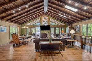 Great Room leads out to massive screen porch.