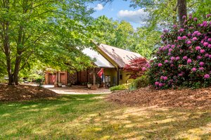 Walk the grounds with rhododendrum, azaleas, and natural stone elements throughout!
