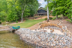 Lakeside retreat with firepit and ample firewood cut for you!