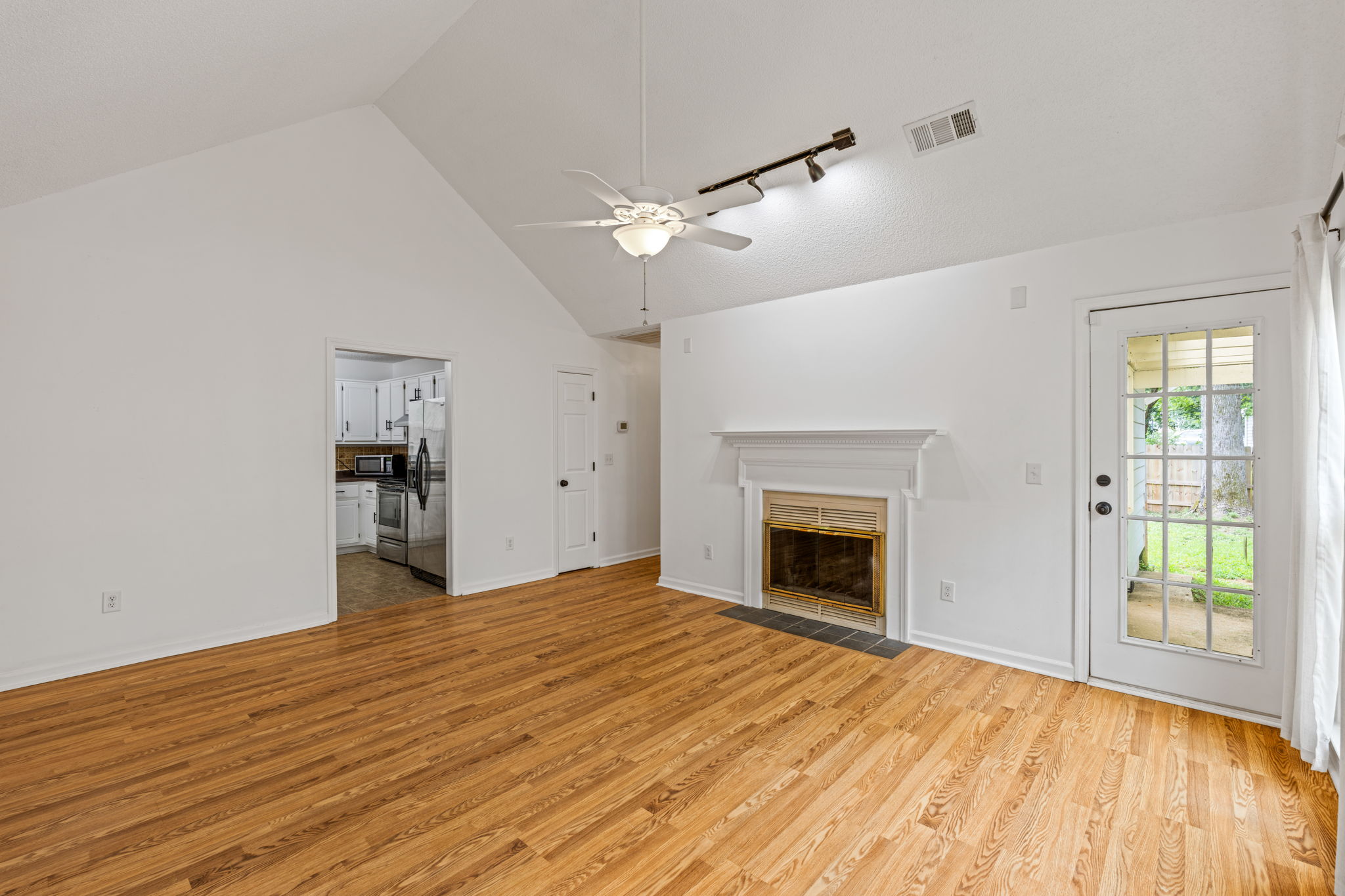 Living Room w/ wood-burning Fireplace