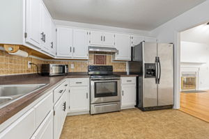 Kitchen w/ White Cabinets