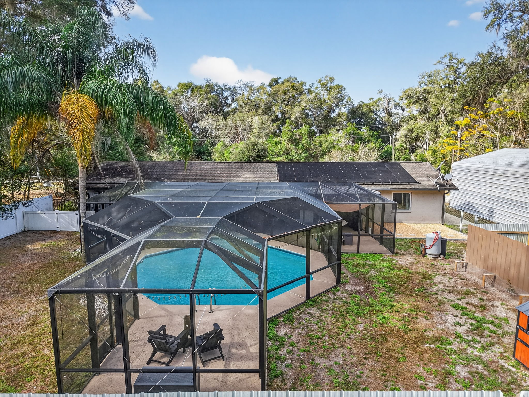 Aerial Rear View of Swimming Pool and Fenced Yard