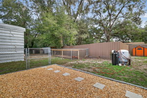 Fenced Yard with Stoned Area and Chicken Coop