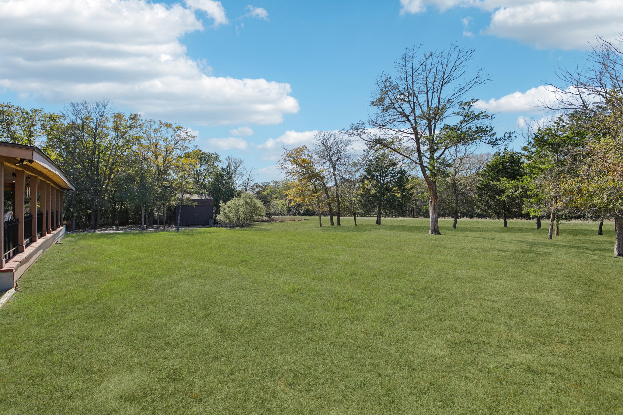 .678 Acres with large covered back porch