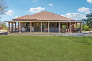 .678 Acres with large covered back porch
