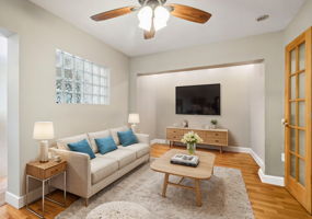 Virtually staged primary bedroom sitting area