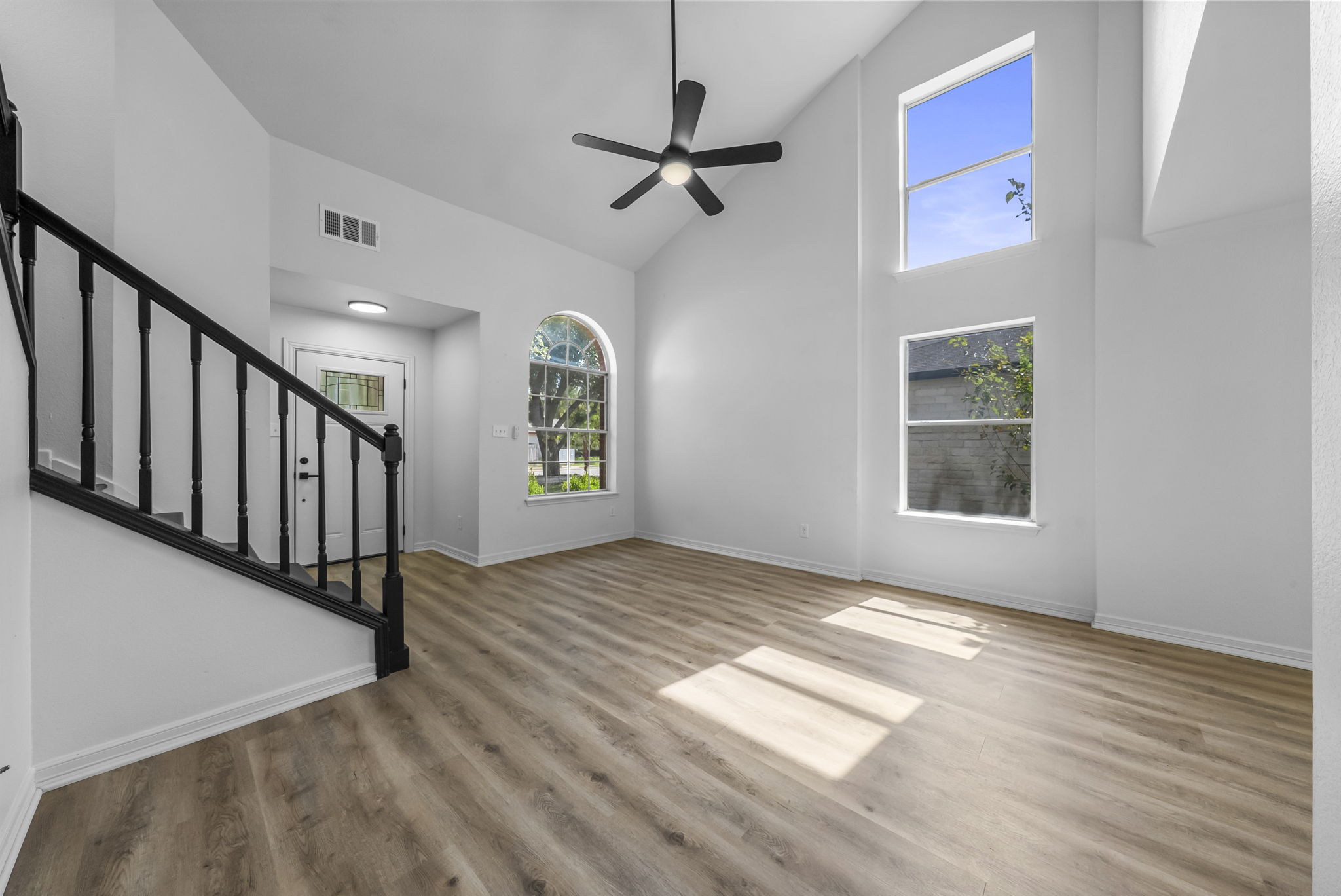 Living room with soaring ceilings and natural light