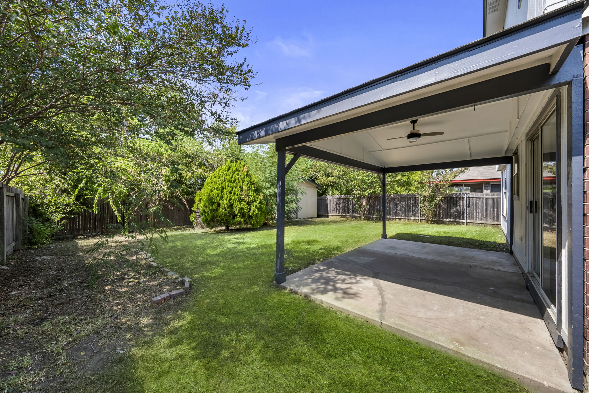 Large, fenced back yard and a spacious covered patio