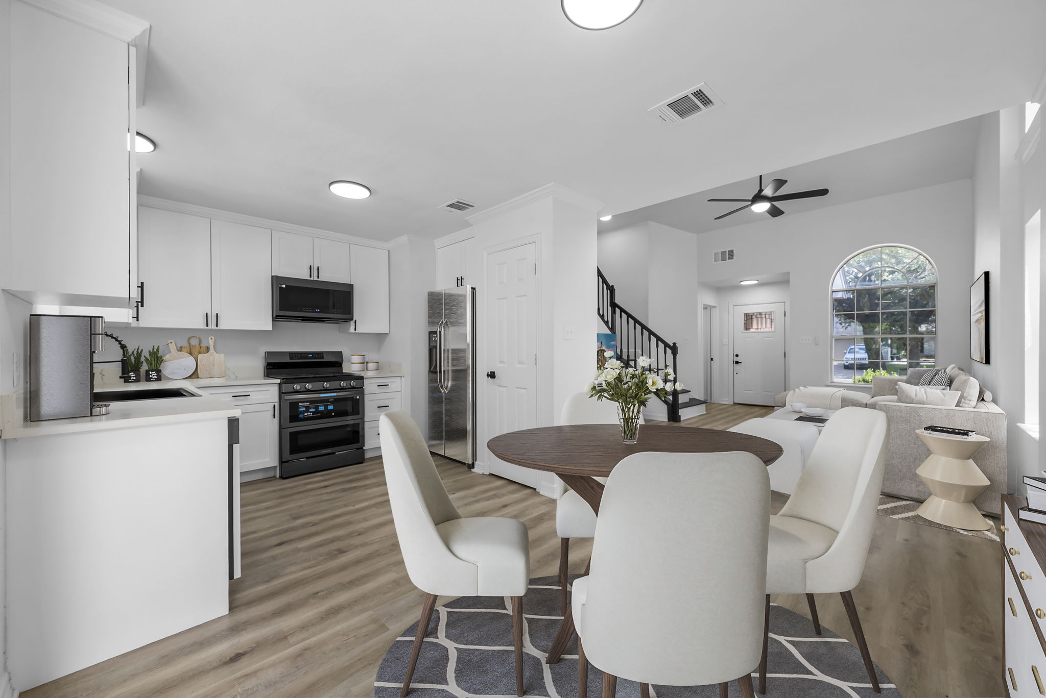 Virtually staged. Open floor plan, updated kitchen and appliances, flooring and more.