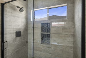Primary bathroom featuring a stall shower