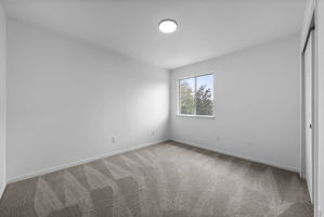 Bedroom 3 of 3 on the upper level to the right of the steps and at the front of the house