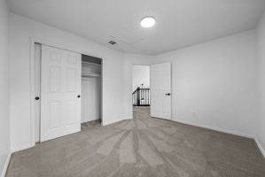 Bedroom 2 of 3 on the upper level to the right of the steps and at the back of the house