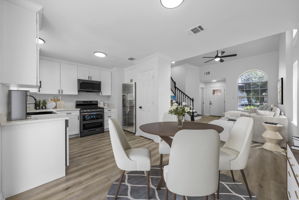 Virtually staged. Open floor plan, updated kitchen and appliances, flooring and more.
