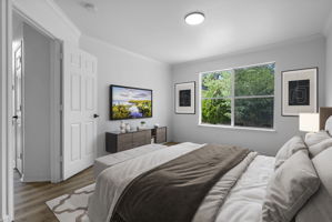 Virtually staged. Primary bedroom at the back of the house on the main level