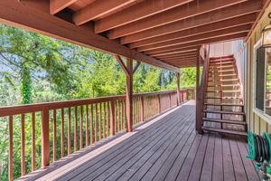 Lower deck spans entire width of house
