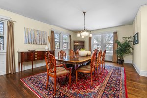 Formal Dining Room with wood floors and Rejuvenation Chandelier