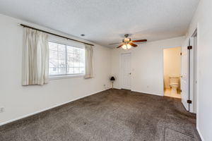 Primary bedroom and view of the bathroom entry & walk-in closet