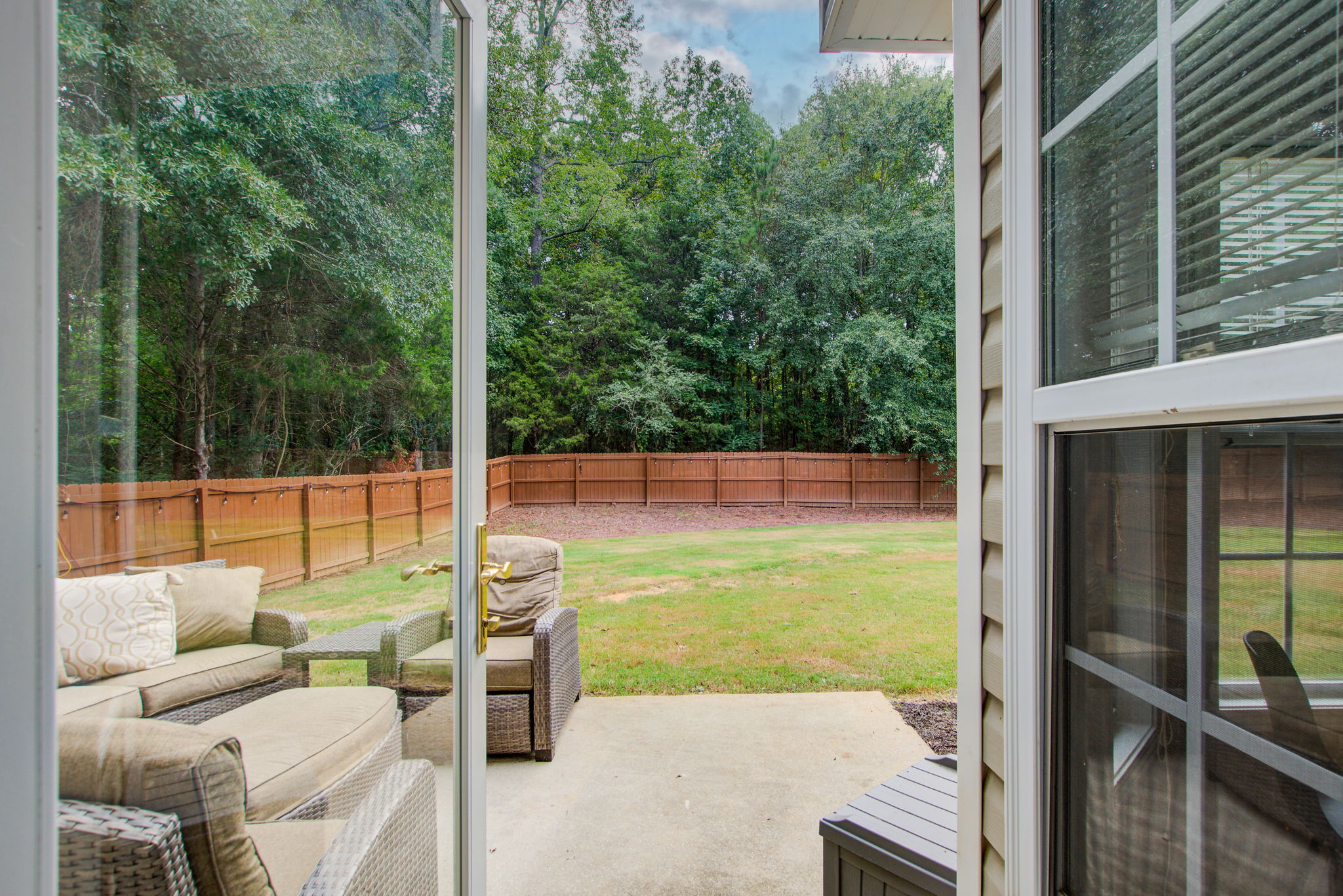 11 Exterior Back Patio + Yard View from Kitchen Walkout