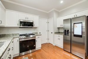 14 Kitchen w Laundry + Garage Access