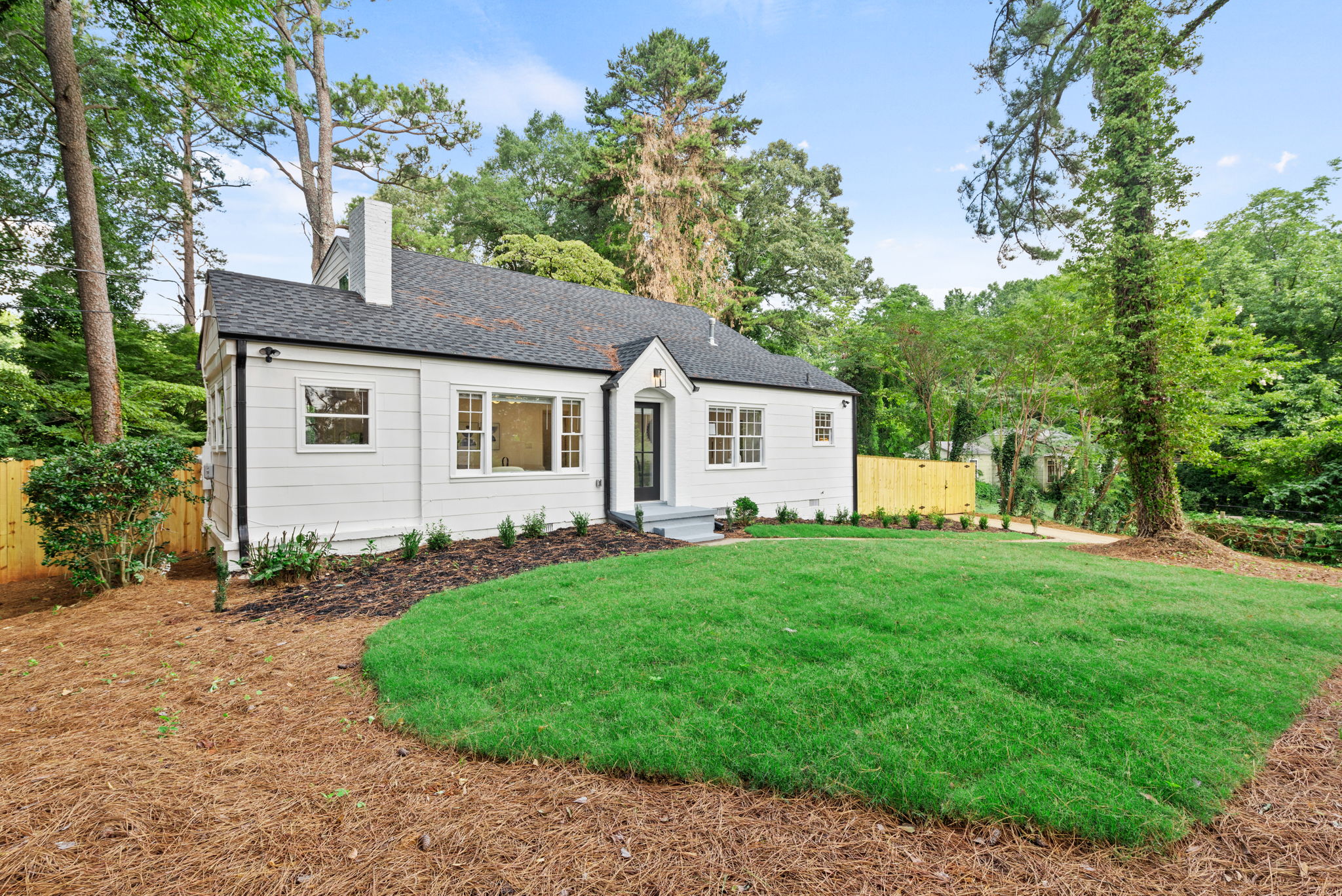 Front of Structure  -  Welcome to this beautifully renovated bungalow featuring a charming facade that sets the tone for the upscale living experience within.