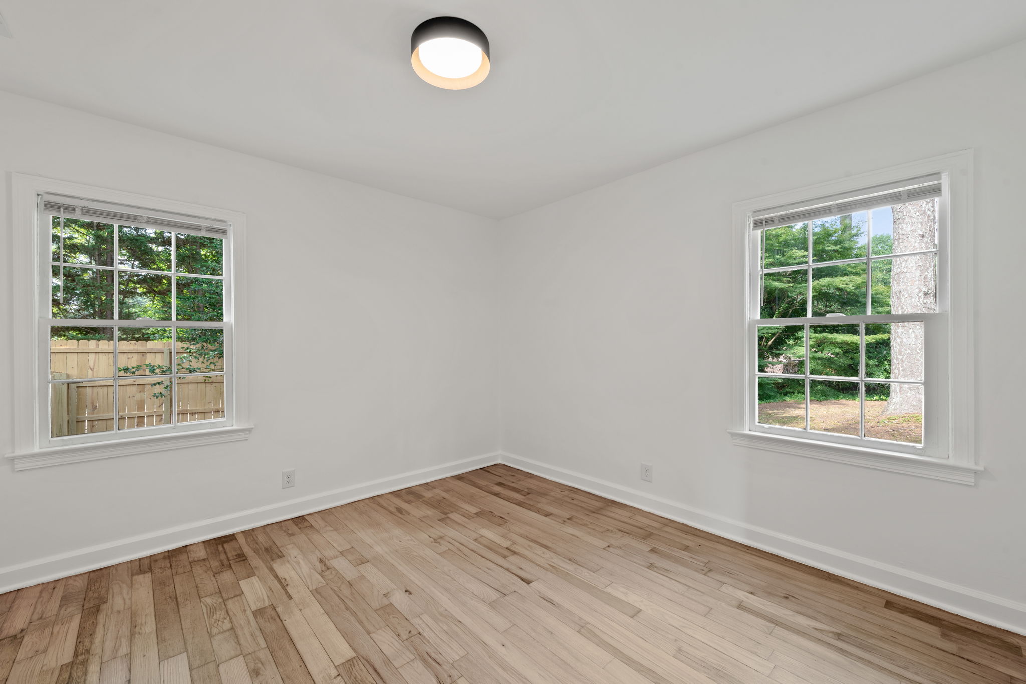 Secondary Bedroom #1 - To the left of the hallway extending from the living room, Bedroom 1 provides ample space for relaxation.