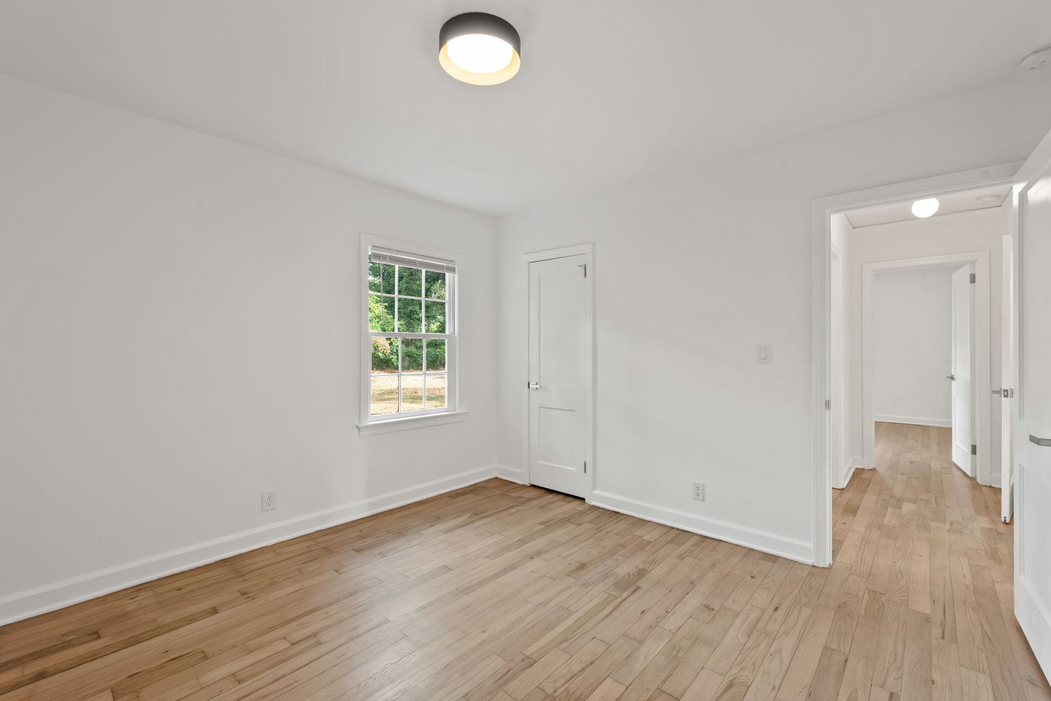 Secondary Bedroom #1 - To the left of the hallway extending from the living room, Bedroom 1 provides ample space for relaxation.