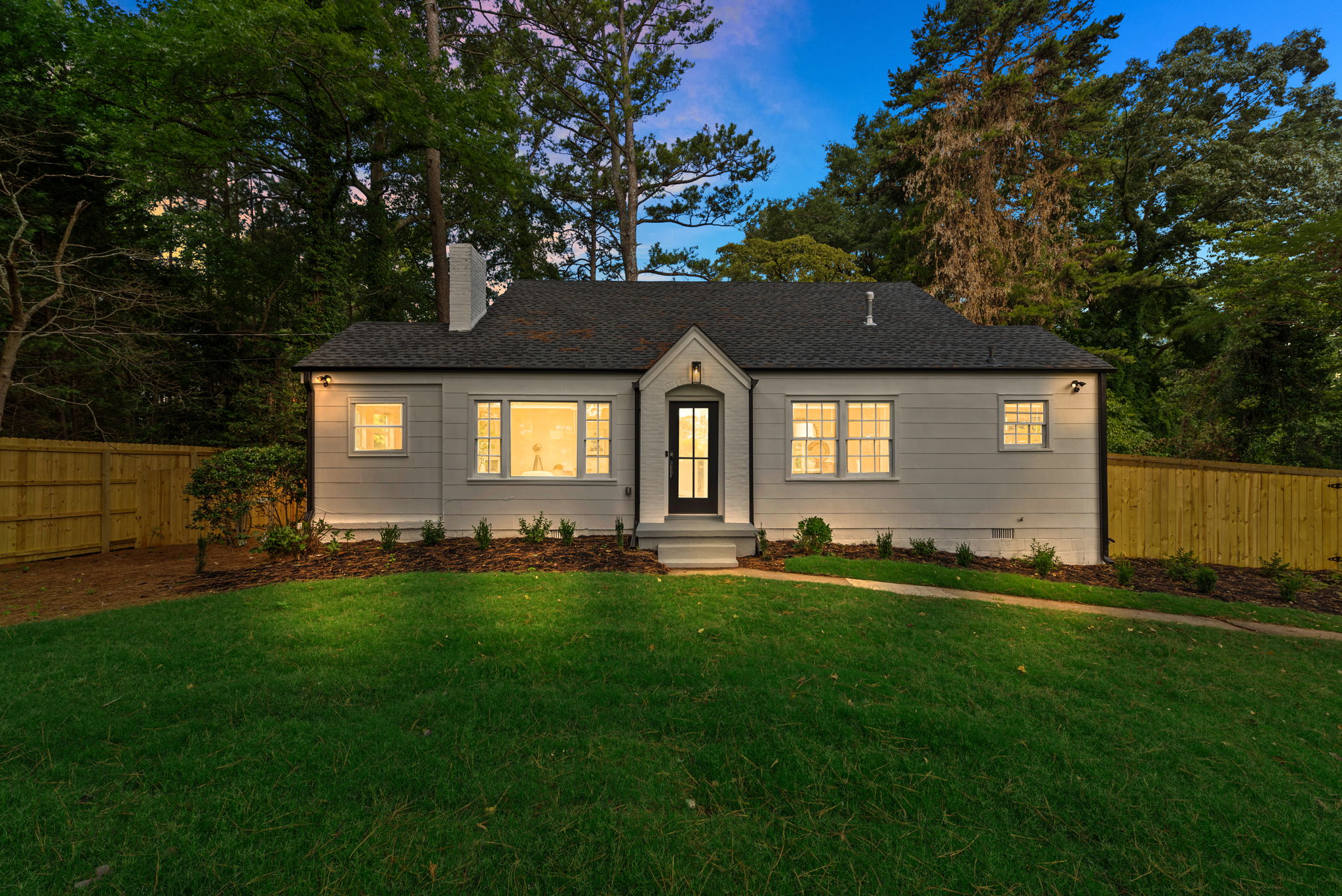 Front of Structure - Welcome to this beautifully renovated bungalow featuring a charming facade that sets the tone for the upscale living experience within.