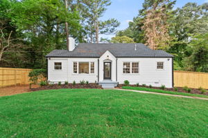 Front of Structure  -  Welcome to this beautifully renovated bungalow featuring a charming facade that sets the tone for the upscale living experience within.