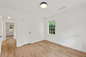 Secondary Bedroom #2 - To the right of the hallway extending from the living room, Bedroom 2 provides similar spaciousness, perfect for various uses.