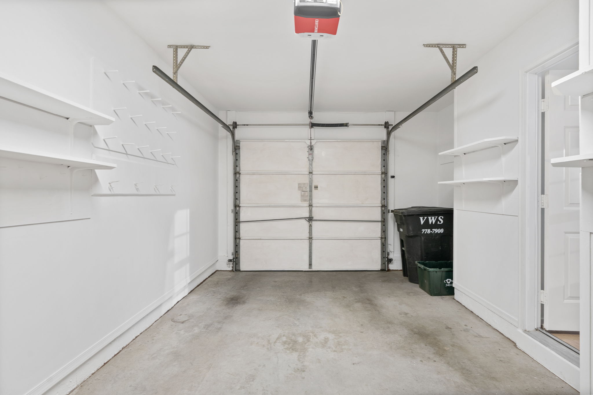 1-Car Garage with fresh paint and new light fixture