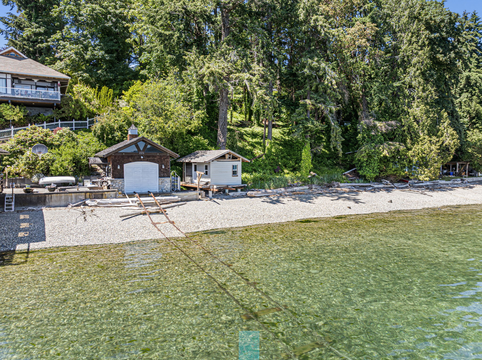 Small yellow boat house near the water for toys