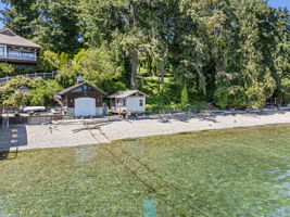 Small yellow boat house near the water for toys