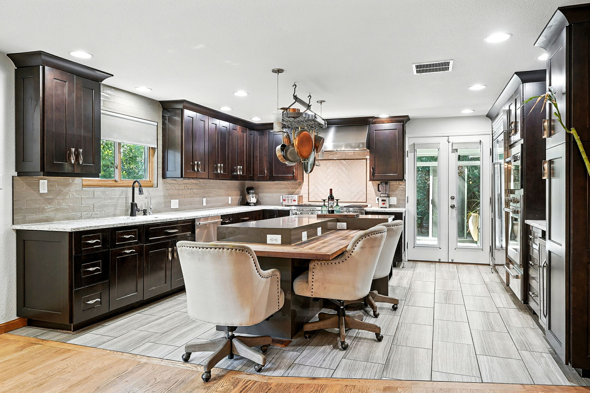 The kitchen is a Chef's delight, complete with top of the line appliances and counter seating!
