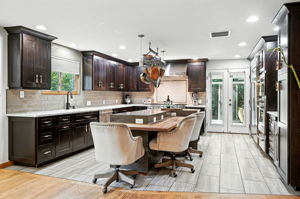 The kitchen is a Chef's delight, complete with top of the line appliances and counter seating!
