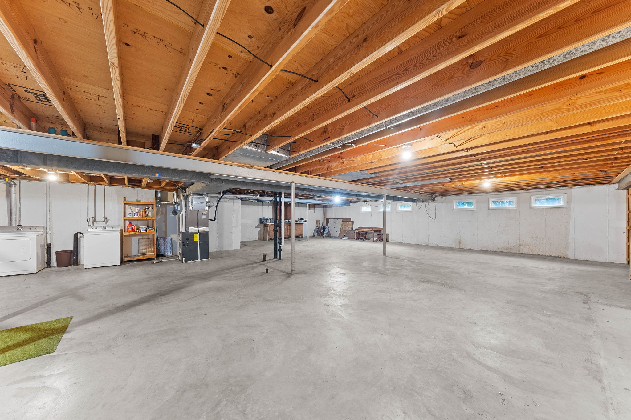 The basement is an enormous CLEAN SLATE awaiting your renovations! It has a sump pump, storage galore, a SECOND laundry, and bath rough-ins. We are including the 2nd washer and dryer with the sale, as well.