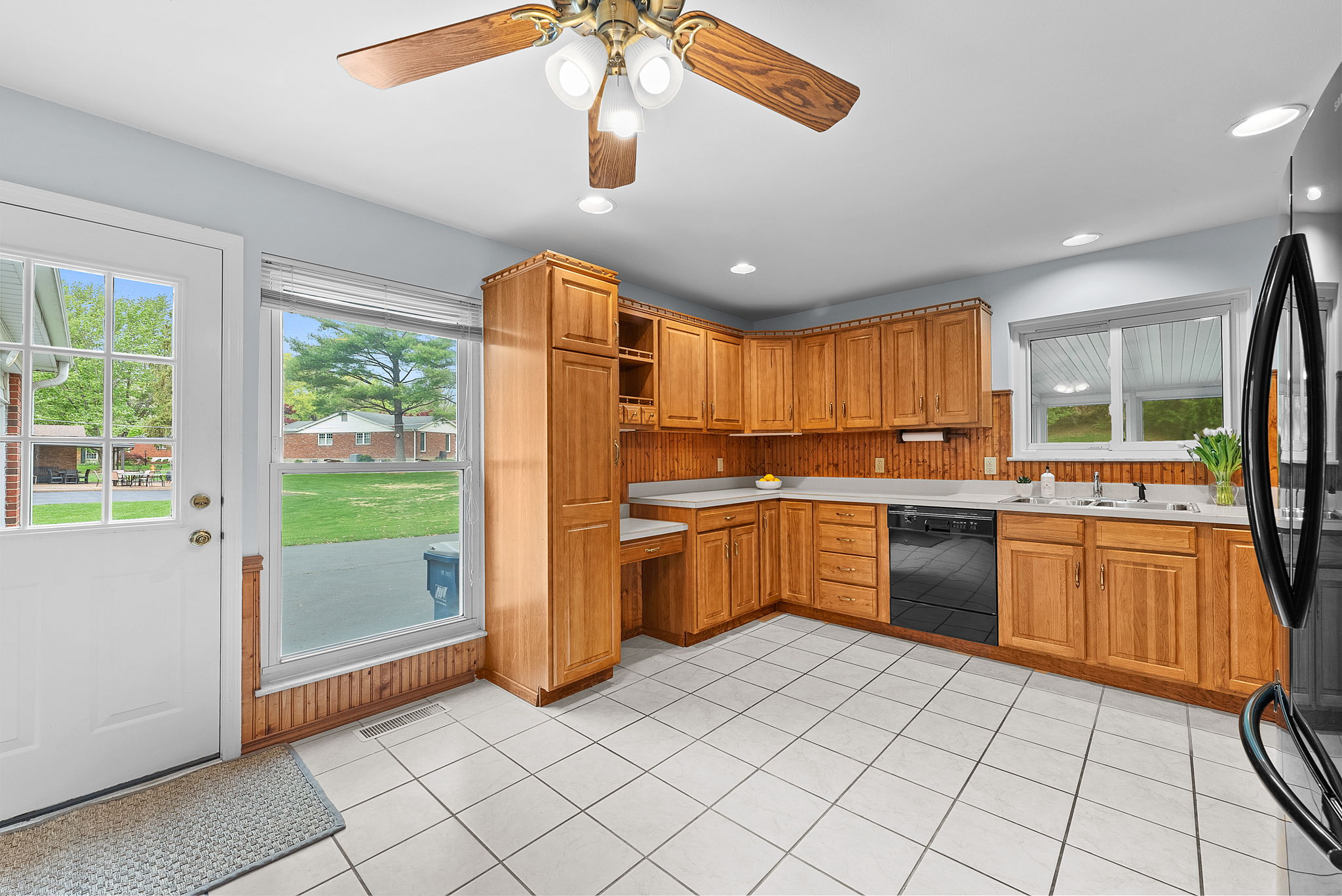 The eat-in kitchen boasts spectacular natural light and storage galore with ample cabinet space.
