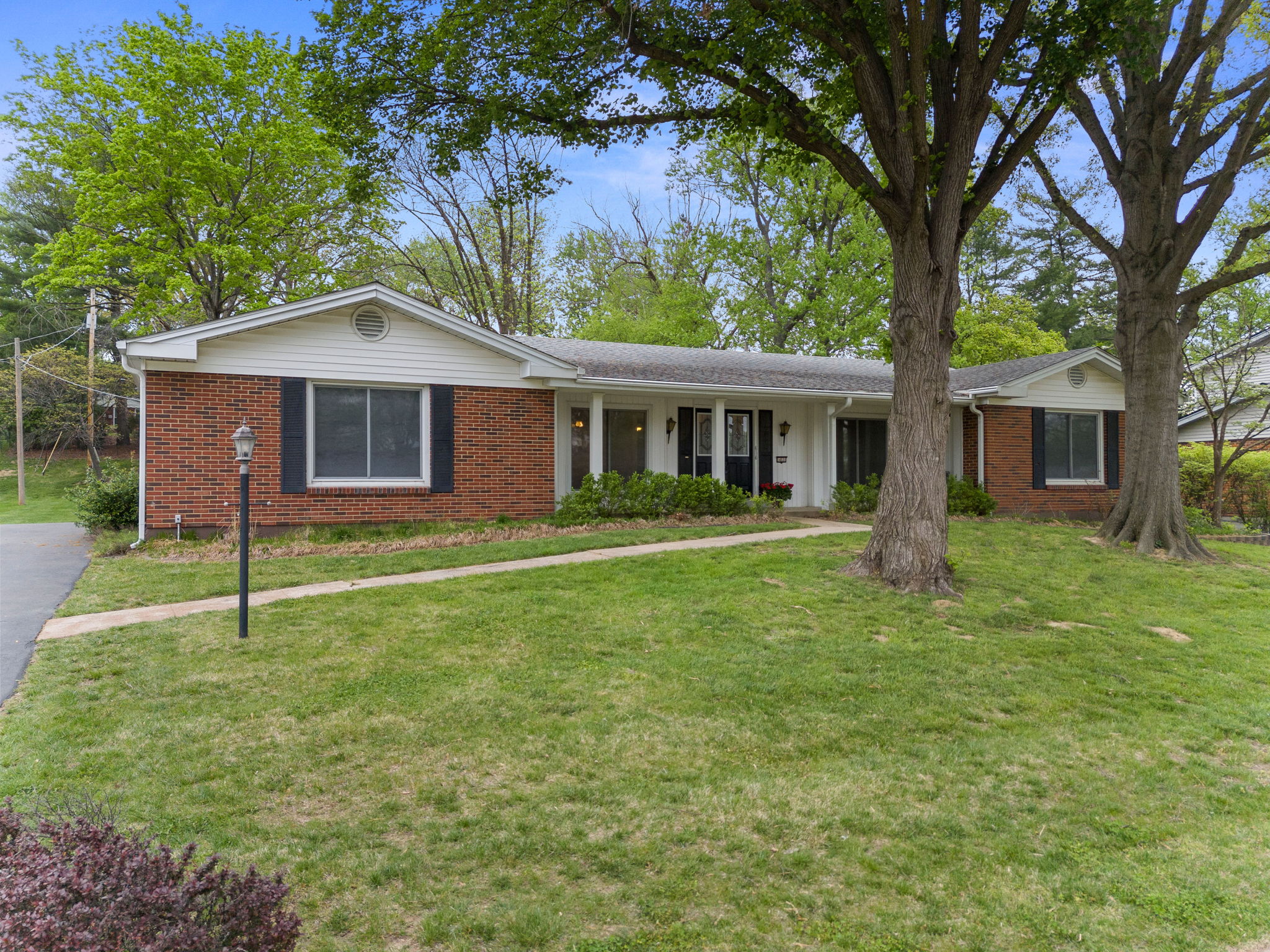 This handsome all-brick ranch is nestled in one of the most popular West County subdivisions. Walk to Green Trails Elementary, minutes from Faust Park.