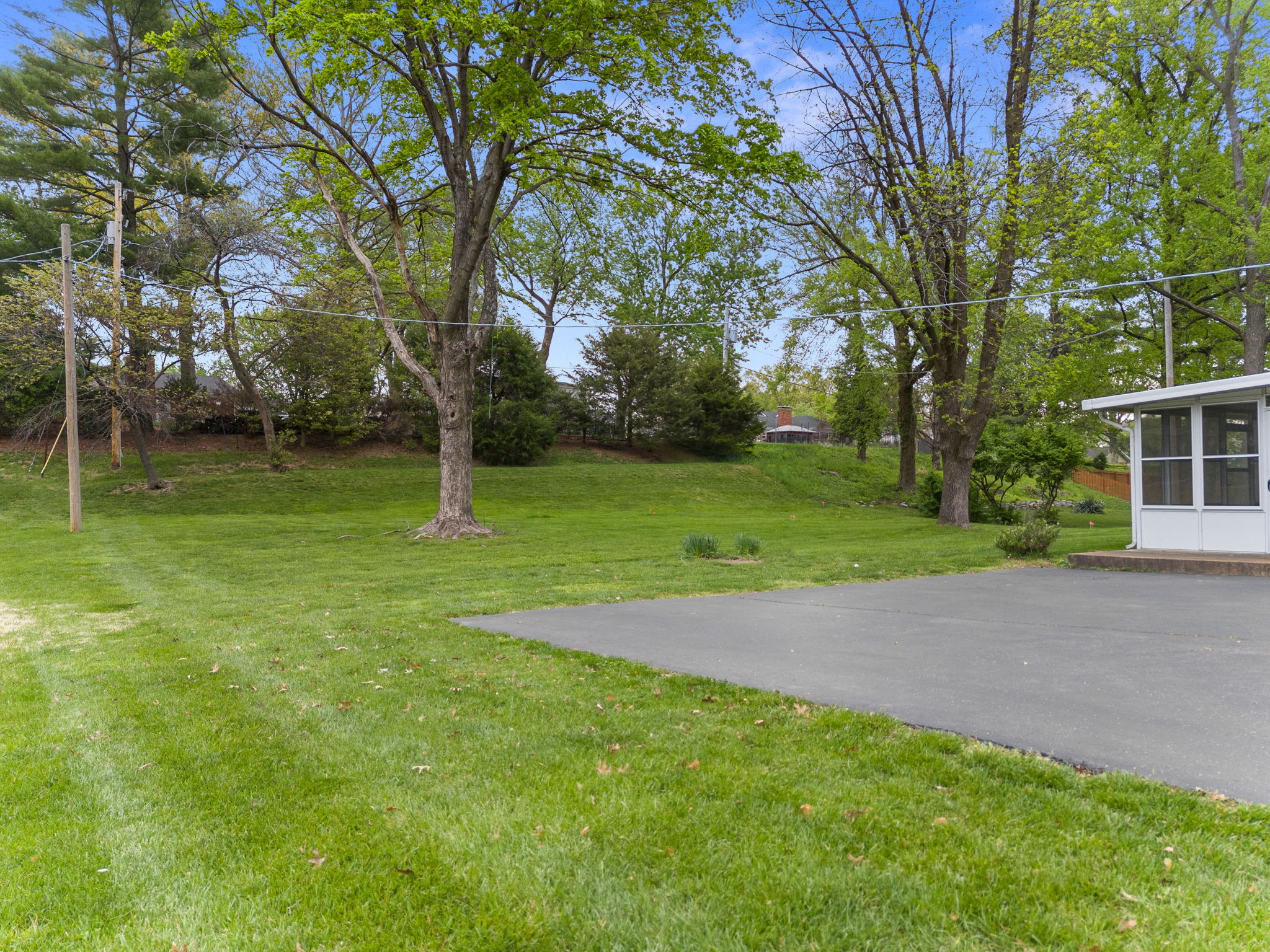 A view of the porch from the back. Room for a playset, pool, patio, and easily fenced for pets!