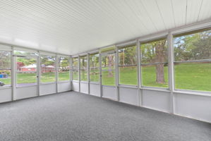 Off of the family room is a gorgeous 21x14 screened in porch with a view of the parklike backyard.