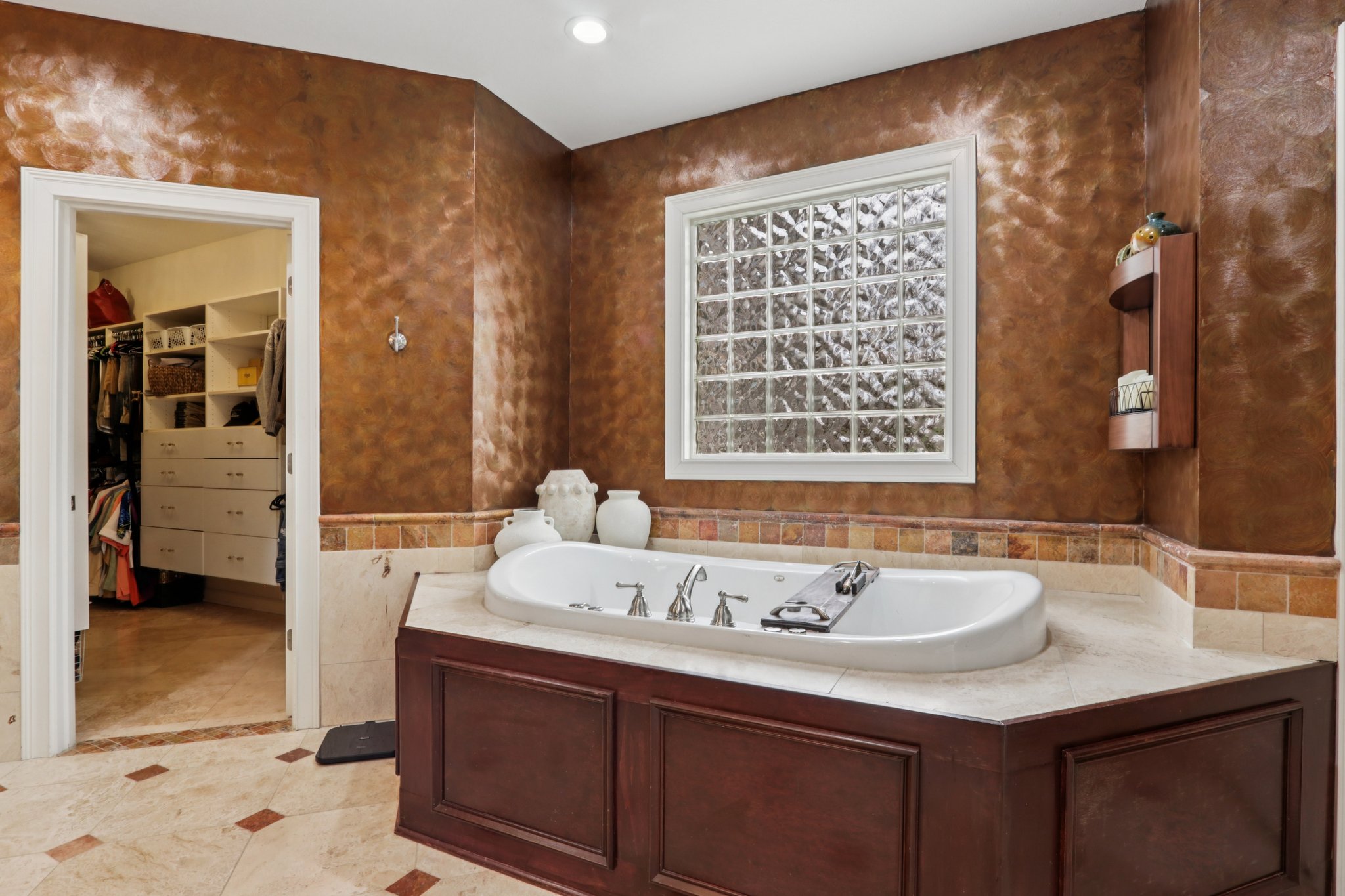 Filled with natural light the whirlpool tub is the perfect place to relax and unwind