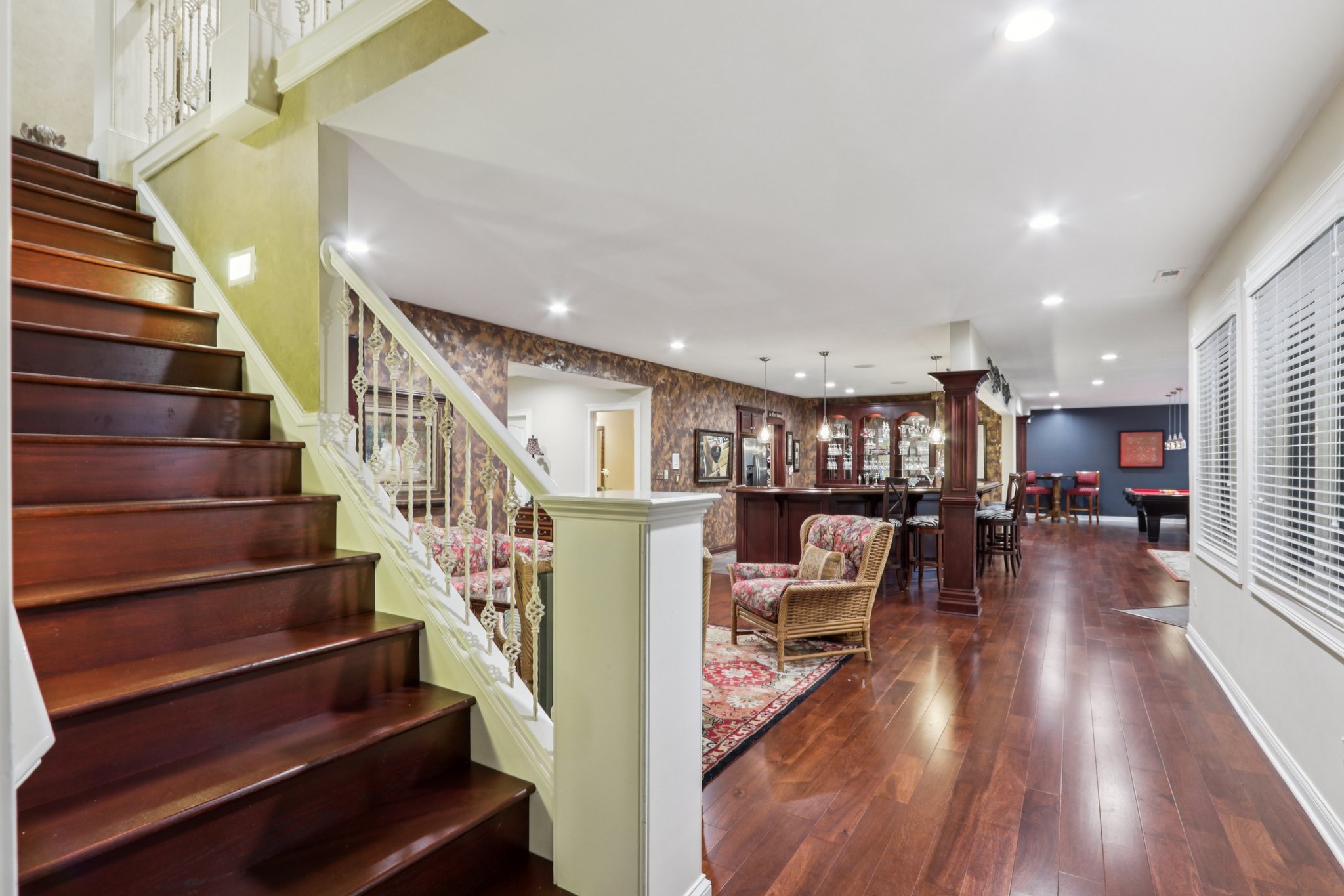 Finished walk-out lower level is an entertainer's dream with Bedroom 4, Gym, Family Room, Bar area, Billiards area, Media area, Wine cellar, and a 2nd Lanai