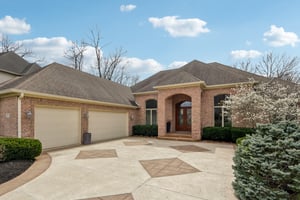 Oversized courtyard garage with extended driveway