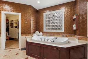 Filled with natural light the whirlpool tub is the perfect place to relax and unwind