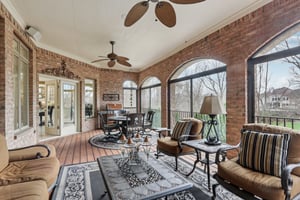 Main level Lanai has staircase to the lower level large paver patio area with outdoor gas fireplace