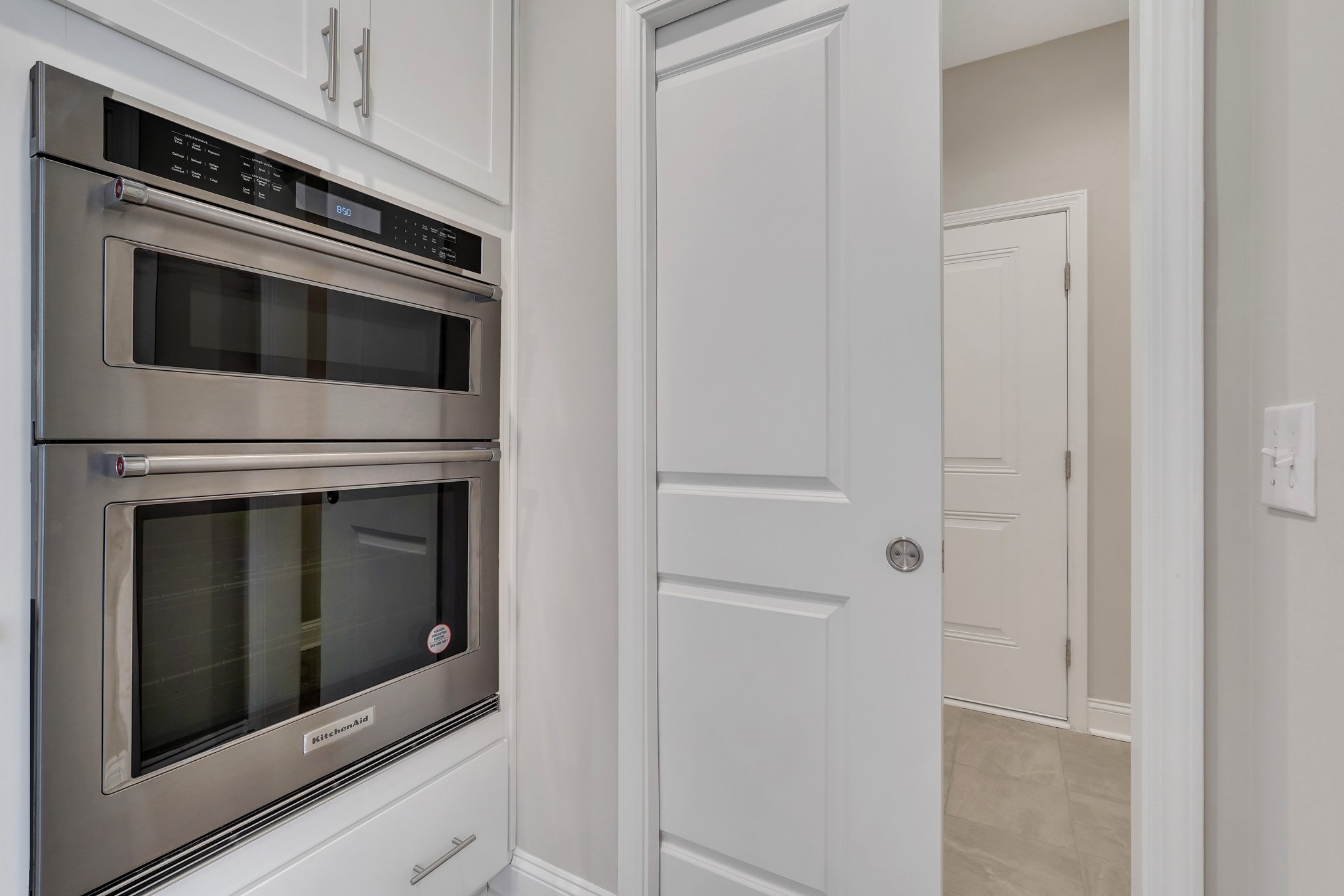 KitchenAid Convection Oven & Microwave.  Pocket door between kitchen & laundry room.